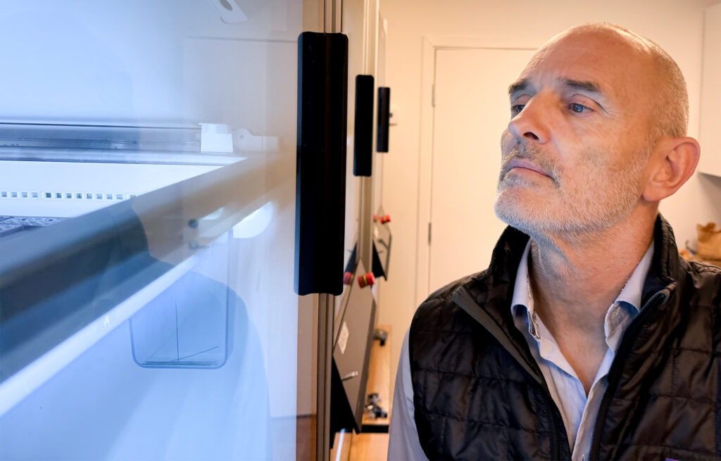 Asbjörn Frydenlund, CEO, Nowhere Networks, looking into one of Nowhere Networks 3D printers.
